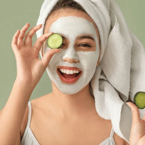 DALL_E_2024-10-01_17.29.26_-_A_centered_image_of_a_cheerful_woman_with_a_glowing_smile_sitting_comfortably_with_a_neat_white_facial_mask_applied_to_her_face._Her_hair_is_tied_bac_300x_21ea1547-dcd6-49e8-9310-454eaf7d12ba.jpg